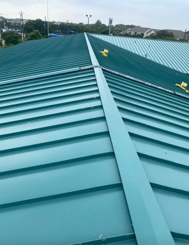 Green commercial metal roof ridge and valley for Metal Roof Repair in Grand Haven