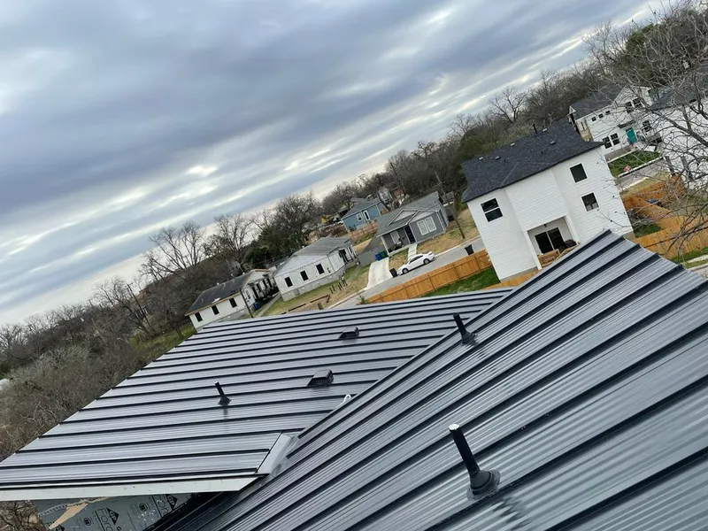 Standing seam metal roof panels with vents for Skylight Repair in Grand Haven